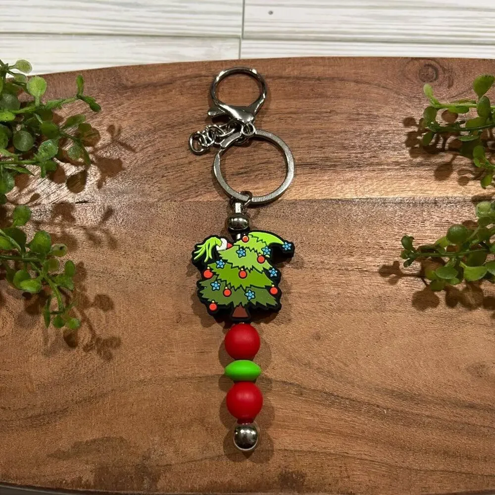 Grinch Bar Keychains in Festive Tree and Leopard Beads for Holiday Gifts - Picture 2 of 3